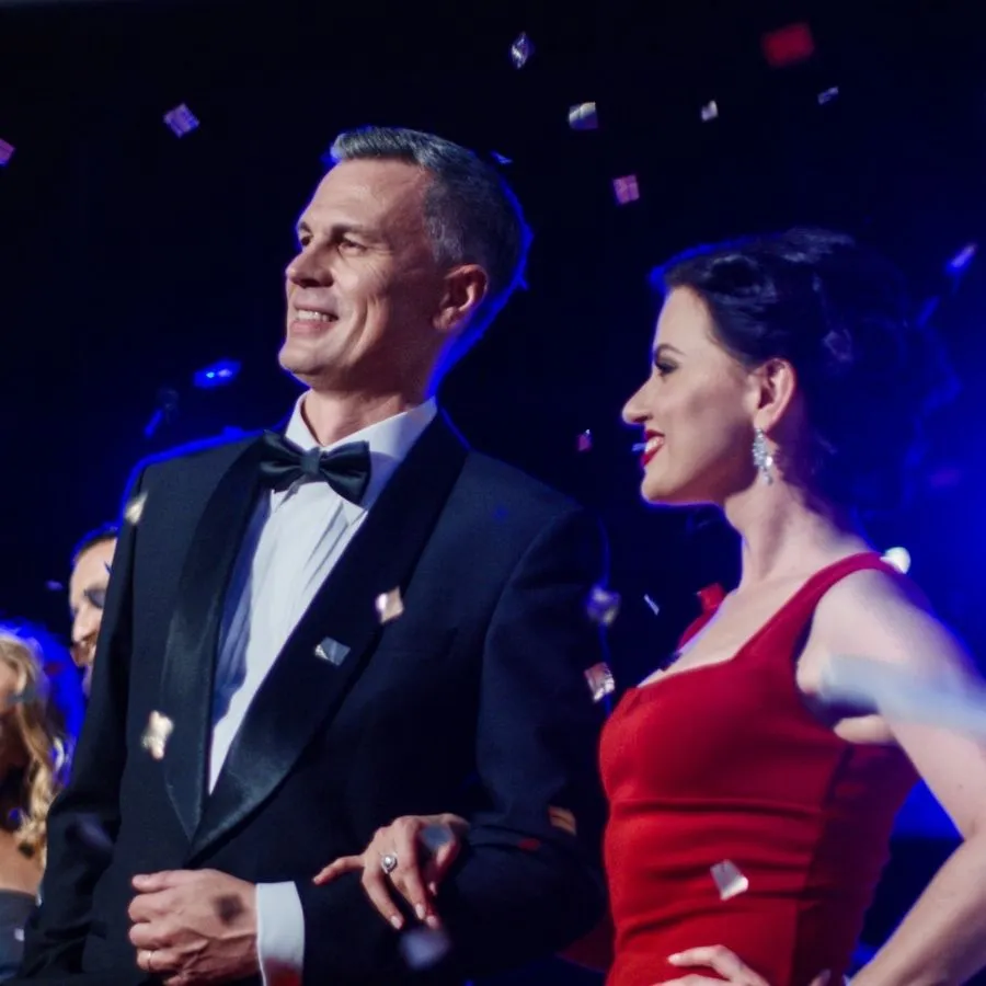 Elegant black-tie guests arriving at an awards evening